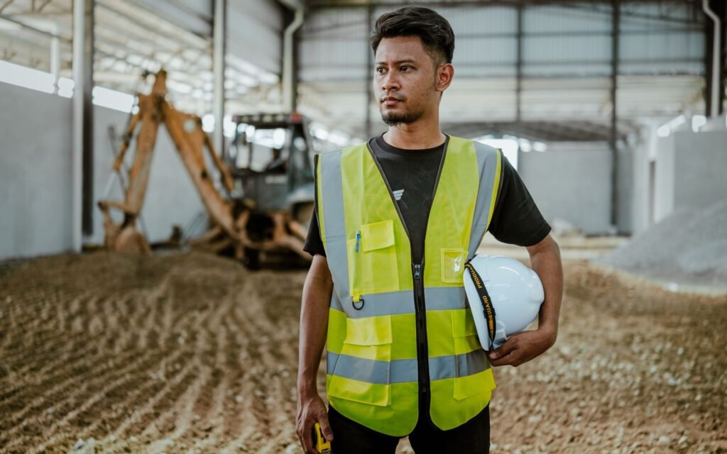 Worker holding a hard hat, showing the shell and suspension